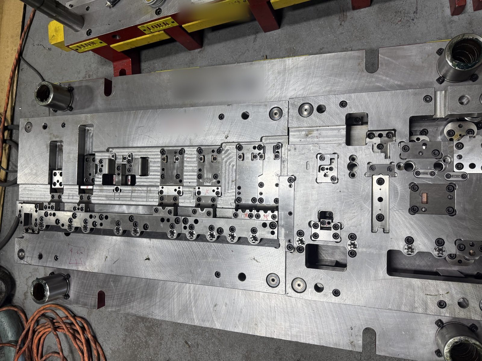 Progressive die lower half with forming stations