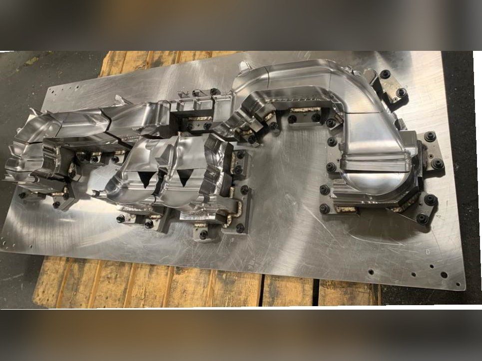 Cross car duct trim nest machined from P20, full view